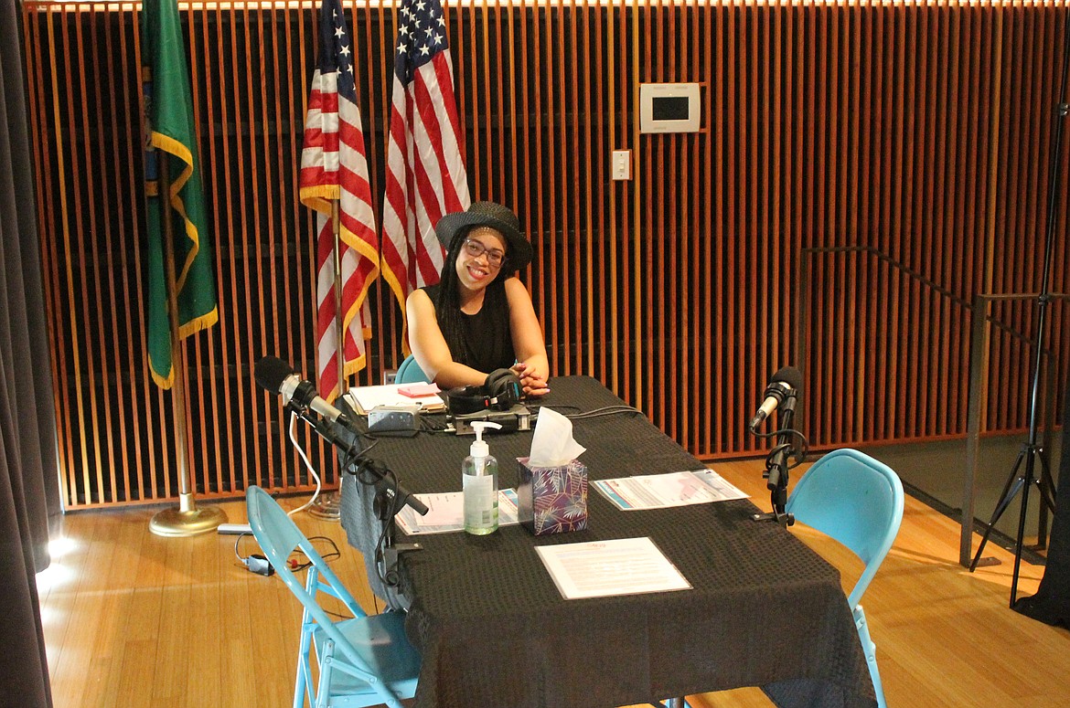 StoryCorps Site Facilitator Teriyana Morton sits in the makeshift recording studio set up in the Moses Lake Civic Center auditorium. Morton and her team will be recording stories from ordinary people in the local community until July 29.