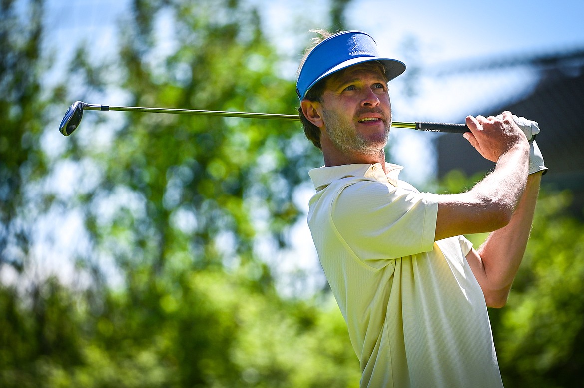 Andrew Medley watches his tee shot on the second hole of the North Course during the Earl Hunt Memorial Fourth of July Tournament at Whitefish Lake Golf Club on Thursday, June 30. (Casey Kreider/Daily Inter Lake)