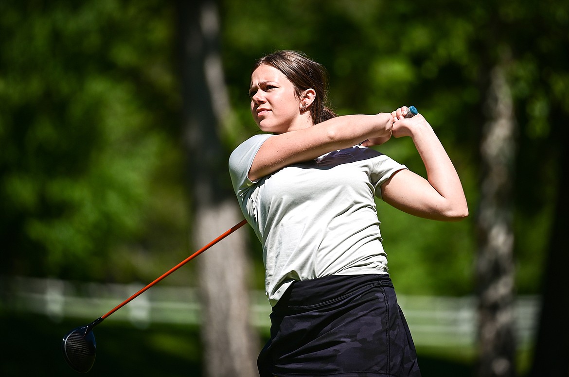 Chloe Tanner watches her tee shot on the eleventh hole of the South Course during the Earl Hunt Memorial Fourth of July Tournament at Whitefish Lake Golf Club on Thursday, June 30. (Casey Kreider/Daily Inter Lake)
