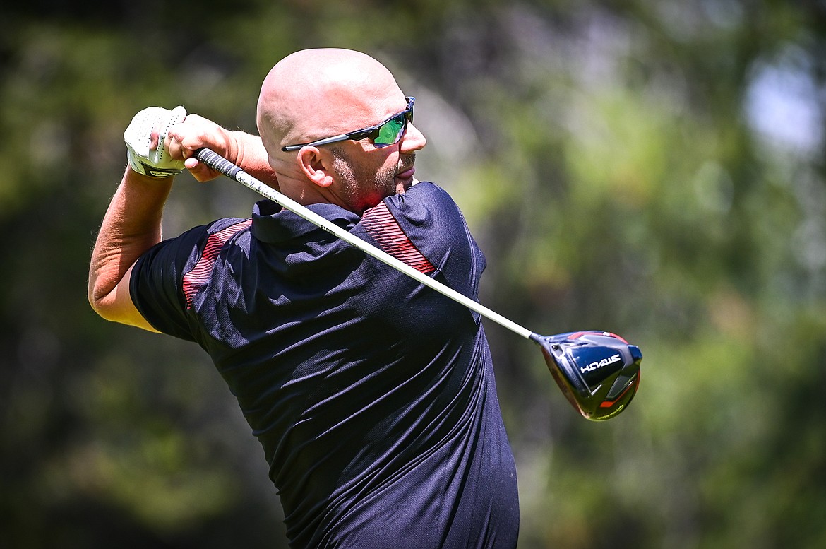 Shawn Tucker watches his tee shot on the ninth hole of the North Course during the Earl Hunt Memorial Fourth of July Tournament at Whitefish Lake Golf Club on Thursday, June 30. (Casey Kreider/Daily Inter Lake)