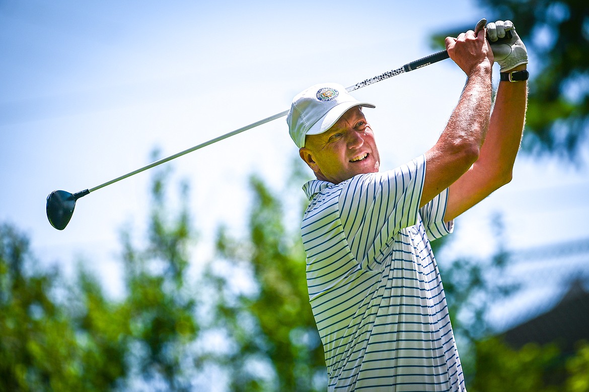 Mark Mance watches his tee shot on the second hole of the North Course during the Earl Hunt Memorial Fourth of July Tournament at Whitefish Lake Golf Club on Thursday, June 30. (Casey Kreider/Daily Inter Lake)