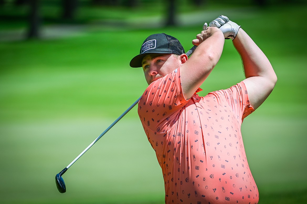 Joey Moore watches his tee shot on the second hole of the North Course during the Earl Hunt Memorial Fourth of July Tournament at Whitefish Lake Golf Club on Thursday, June 30. (Casey Kreider/Daily Inter Lake)