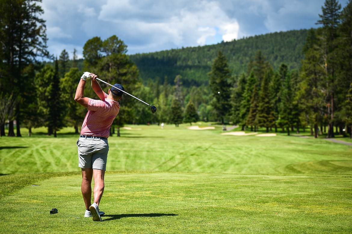 Art Doorn watches his tee shot on the first hole of the North Course during the Earl Hunt Memorial Fourth of July Tournament at Whitefish Lake Golf Club on Thursday, June 30. (Casey Kreider/Daily Inter Lake)