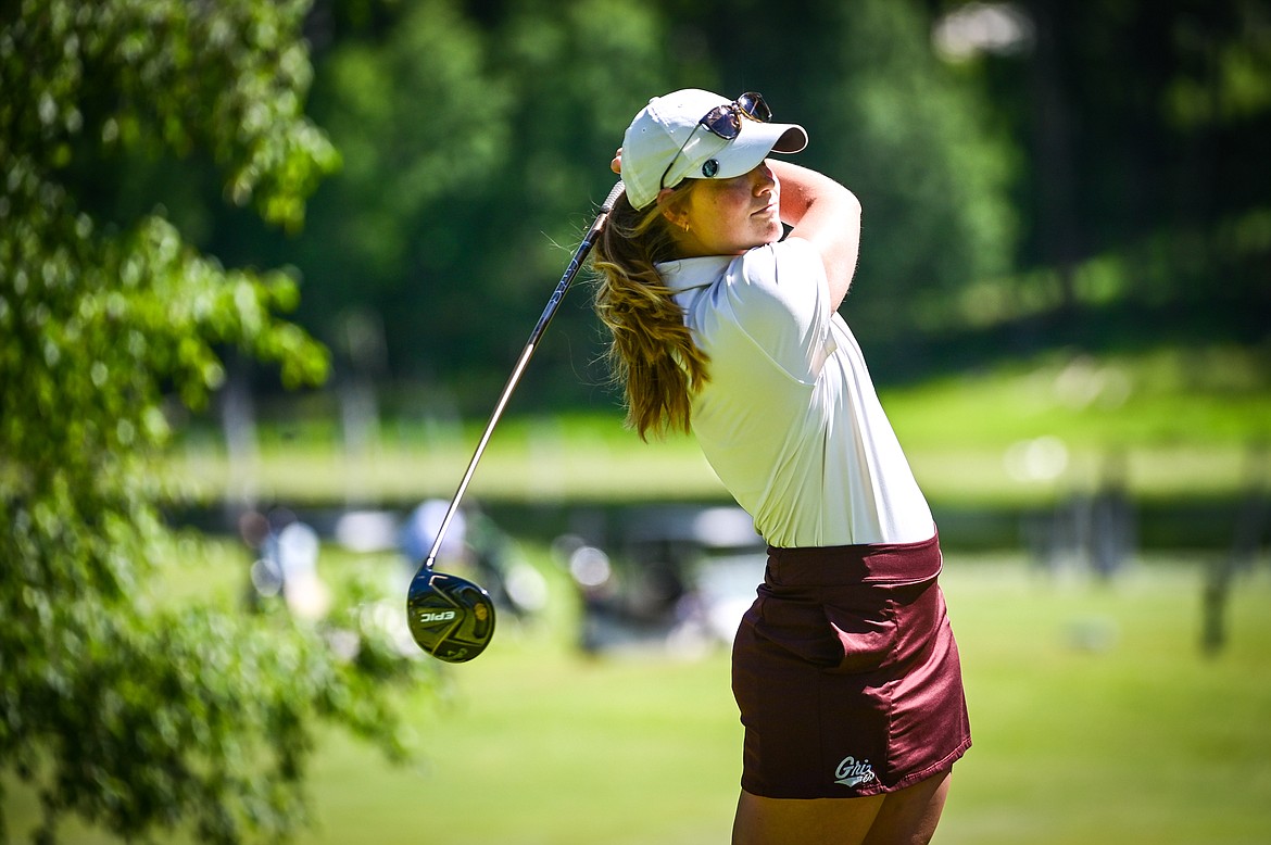 Teigan Avery watches her tee shot on the eleventh hole of the South Course during the Earl Hunt Memorial Fourth of July Tournament at Whitefish Lake Golf Club on Thursday, June 30. (Casey Kreider/Daily Inter Lake)