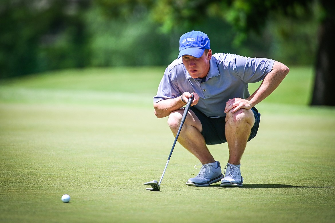 Cameron Kahle lines up a putt on the second green of the North Course during the Earl Hunt Memorial Fourth of July Tournament at Whitefish Lake Golf Club on Thursday, June 30. (Casey Kreider/Daily Inter Lake)