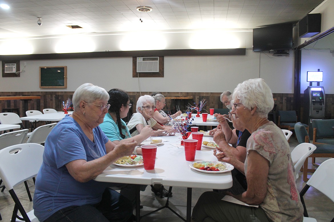 From left: Anita Sather, Arianna Mianecki, Chris Mianecki, Maria Valcarlos (mostly obscured) and Maggie Nielsen enjoy the Royal Slope Seniors salad luncheon June 23.