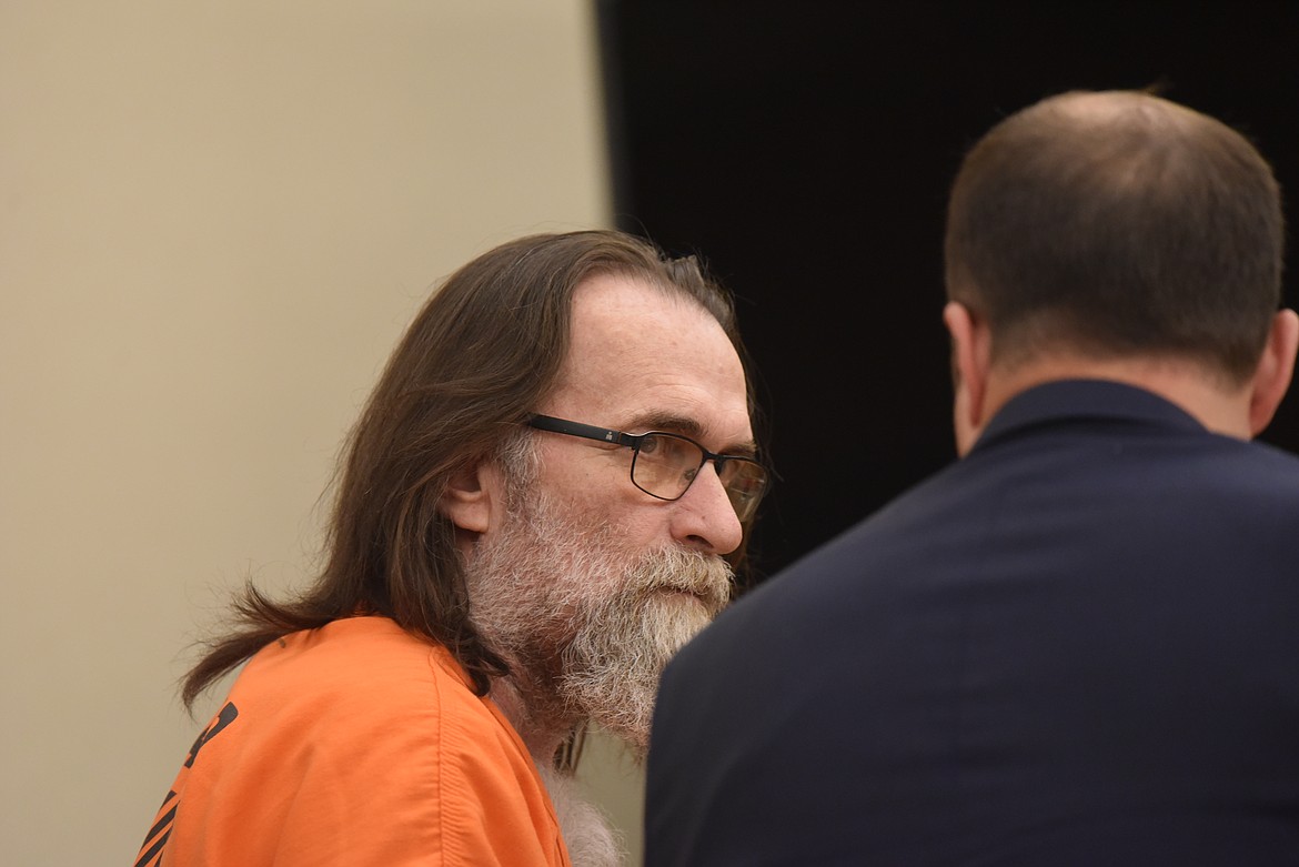 Larry Edmond Ross speaks with defense attorney Daniel Wood in Flathead County District Court during his sentencing on two counts of sexual abuse on June 30, 2022. (Derrick Perkins/Daily Inter Lake)