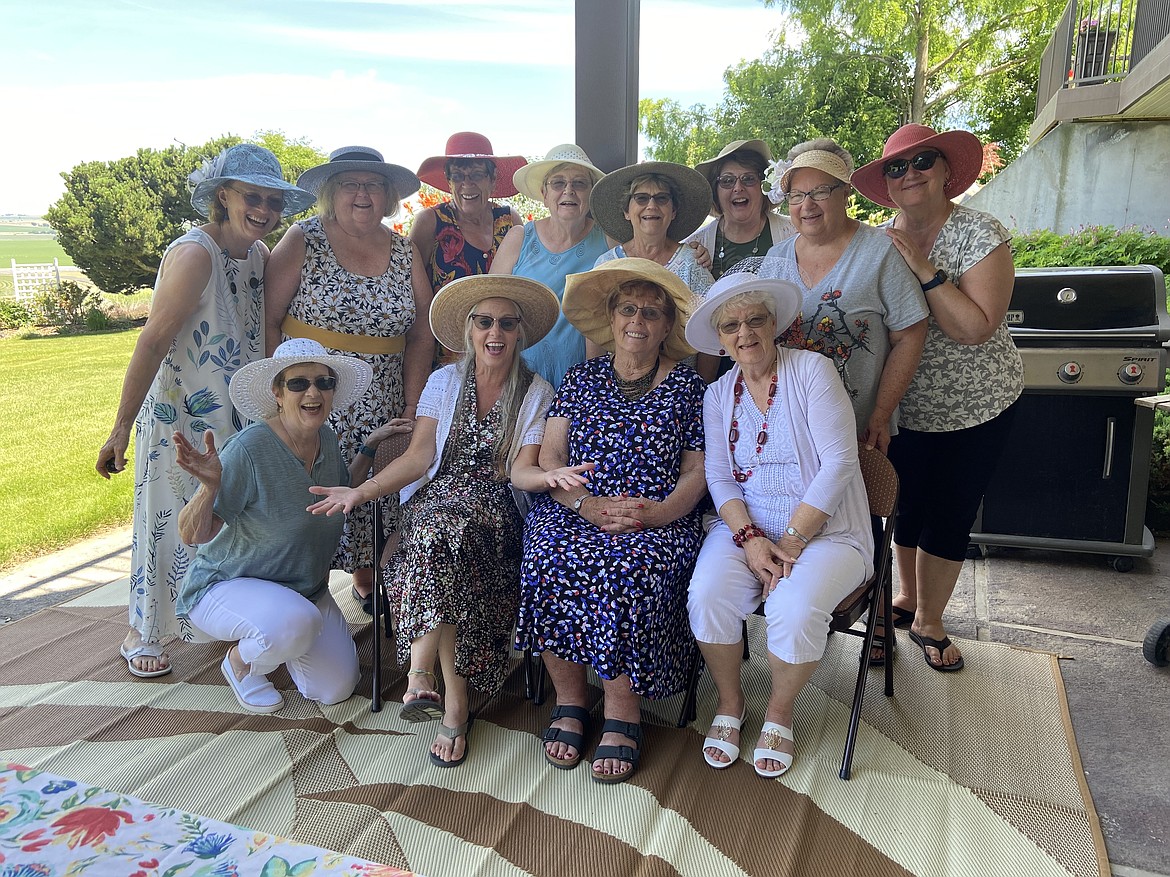 OTHELLO — Members of the Beta Lambda organization in Othello donned their best hats for a garden party and salad luncheon at the home of Carey Higley near Othello. Members attending included (back row, from left) Higley, Trudy Doolittle, Margaret Kirkpatric, Janet Larsen, Janet Dunnagan, Linda Simmons, Sharon Hampton, Annamarie Wilson, (front row, from left) Suzanne Palmiero, Joanne Davis, Sue Flint and Dixie Fultz.