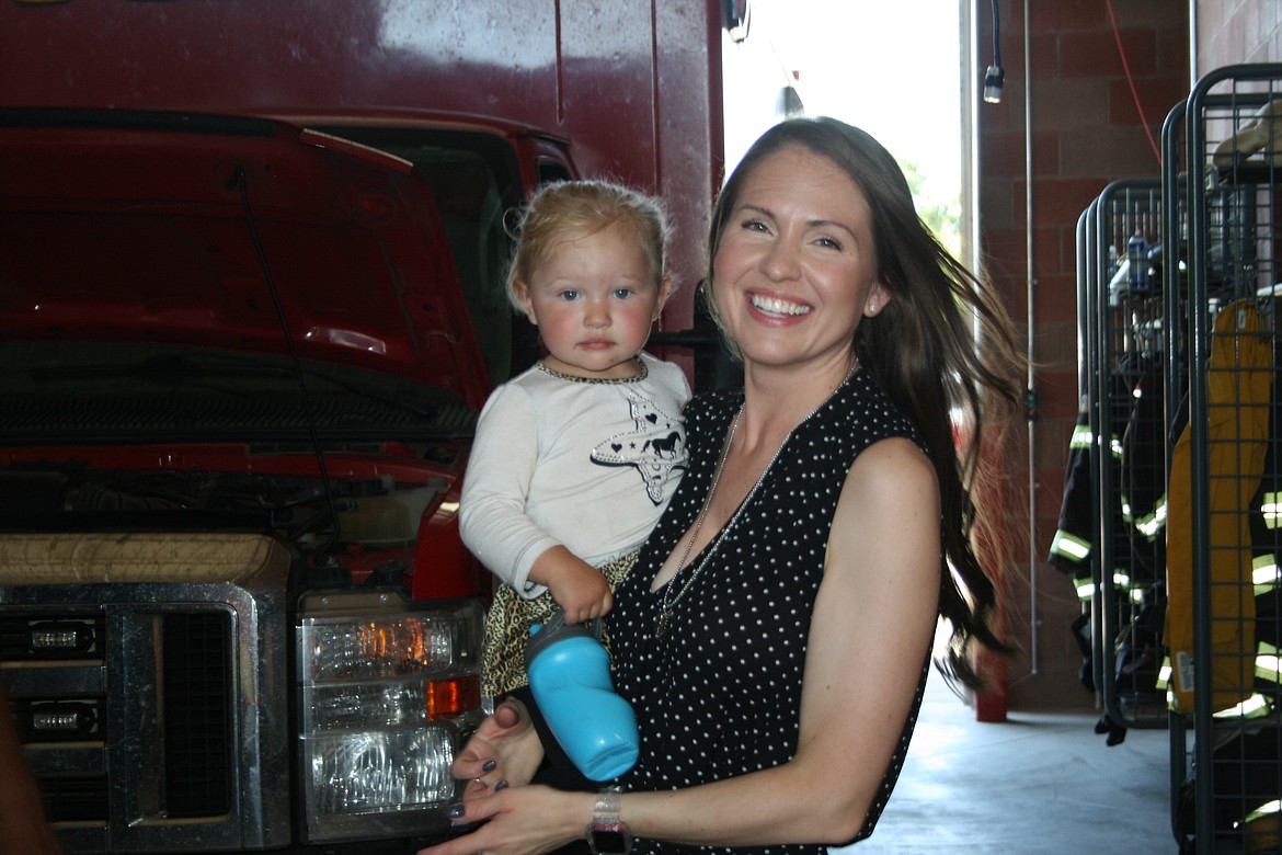 Protection-1 EMS owner Leslie Thompson with Rylinn Massey, daughter of the company’s mechanic, at the station.