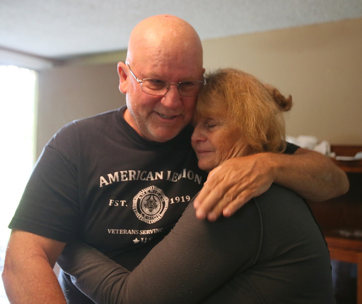 Sandy Jennings thanks American Legion Post 143 adjutant Tim Shaw with a hug for helping coordinate assistance as she and her husband John near the deadline for moving out of their home.