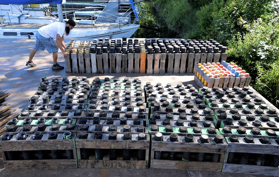 Chris Collison with Pyro Spectaculars arranges mortars at Murphy Marine on Friday for the Fourth of July fireworks show over Lake Coeur d'Alene.