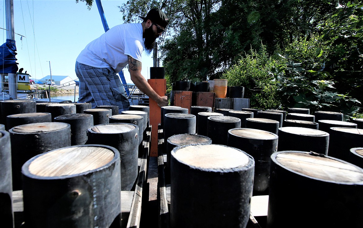 Chris Collison of Pyro Spectaculars sets up mortars on Friday for the fireworks show over Lake Coeur d'Alene on Monday.