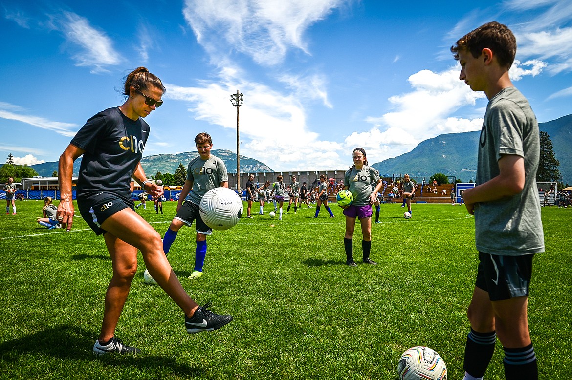 Carli Lloyd demonstrates a drill to attendees of her CL10 Soccer Clinic at Flip Darling Memorial Field at Columbia Falls High School on Saturday, July 2. Lloyd is a former American professional soccer player; a two-time Olympic gold medalist; two-time FIFA Women's World Cup champion; two-time FIFA Player of the Year and a four-time Olympian. (Casey Kreider/Daily Inter Lake)