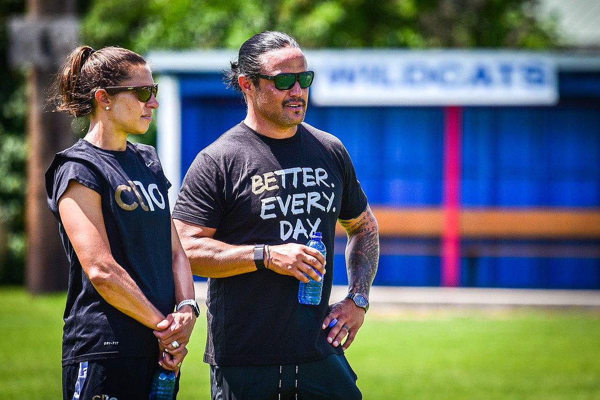 Carli Lloyd and Columbia Falls High School boys head soccer coach O'Brien Byrd talk and watch drills during Lloyd's CL10 Soccer Clinic at Flip Darling Memorial Field in Columbia Falls on Saturday, July 2. Lloyd is a former American professional soccer player; a two-time Olympic gold medalist; two-time FIFA Women's World Cup champion; two-time FIFA Player of the Year and a four-time Olympian. (Casey Kreider/Daily Inter Lake)