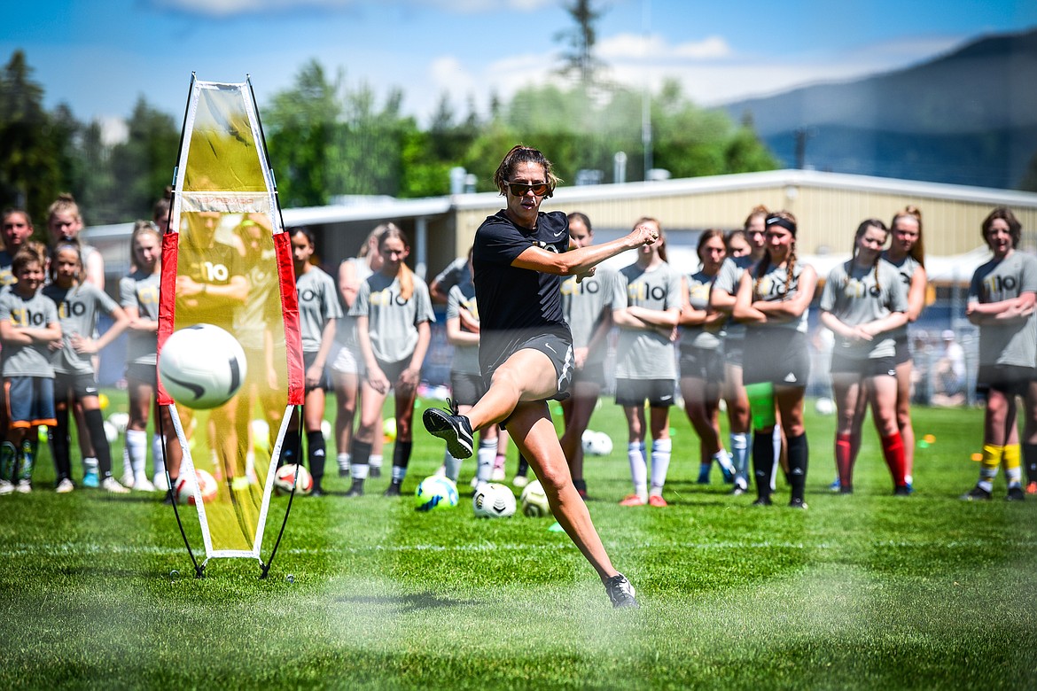 Carli Lloyd demonstrates a drill to attendees of her CL10 Soccer Clinic at Flip Darling Memorial Field at Columbia Falls High School on Saturday, July 2. Lloyd is a former American professional soccer player; a two-time Olympic gold medalist; two-time FIFA Women's World Cup champion; two-time FIFA Player of the Year and a four-time Olympian. (Casey Kreider/Daily Inter Lake)