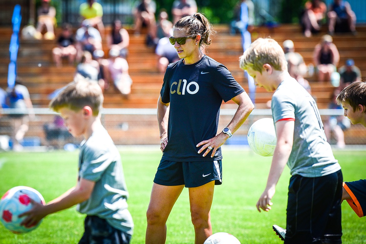 Carli Lloyd watches as kids perform a drill at her CL10 Soccer Clinic at Flip Darling Memorial Field at Columbia Falls High School on Saturday, July 2. Lloyd is a former American professional soccer player; a two-time Olympic gold medalist; two-time FIFA Women's World Cup champion; two-time FIFA Player of the Year and a four-time Olympian. (Casey Kreider/Daily Inter Lake)