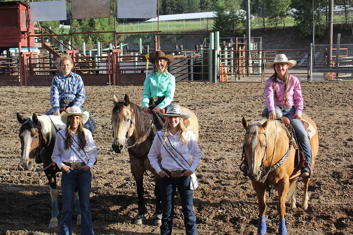 From left saddled up, Rainier Acker, Kodi Kelly and Lanie Crabb. Standing is Bailey Hansen and Heather Haskins. (Monte Turner/Mineral Independent)