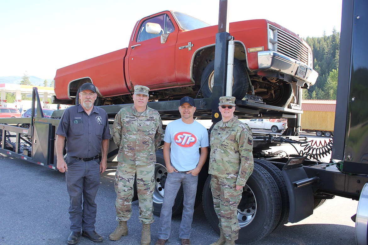 From left, Dwayne Levler, Petty’s Garage; Colonel James Hesterberg, Montana National Guard; Country artist Jared Ashley and Jeff ‘Ozzy’ Otzwirk’s sister, Colonel Mary Devine, Nevada National Gurad stand with the 1983 Chevrolet Scottsdale pickup that will be totally refurbished and tour with the Petty Team for awareness of suicide among military veterans. (Monte Turner/Mineral Independent)