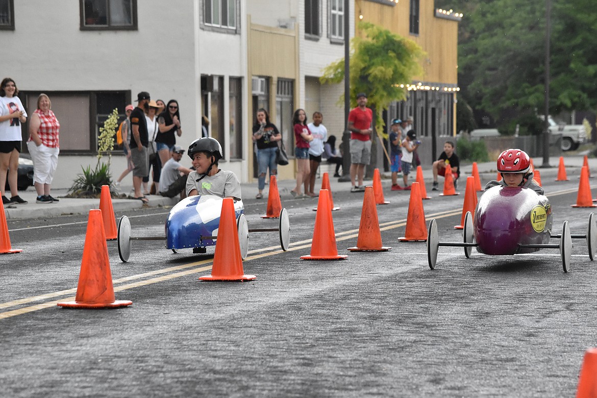 Some children couldn’t help but smile as they rode down the track but others, like Langstyn Rhoads on the right, were completely focused on the finish line. Rhoads took first in the races.