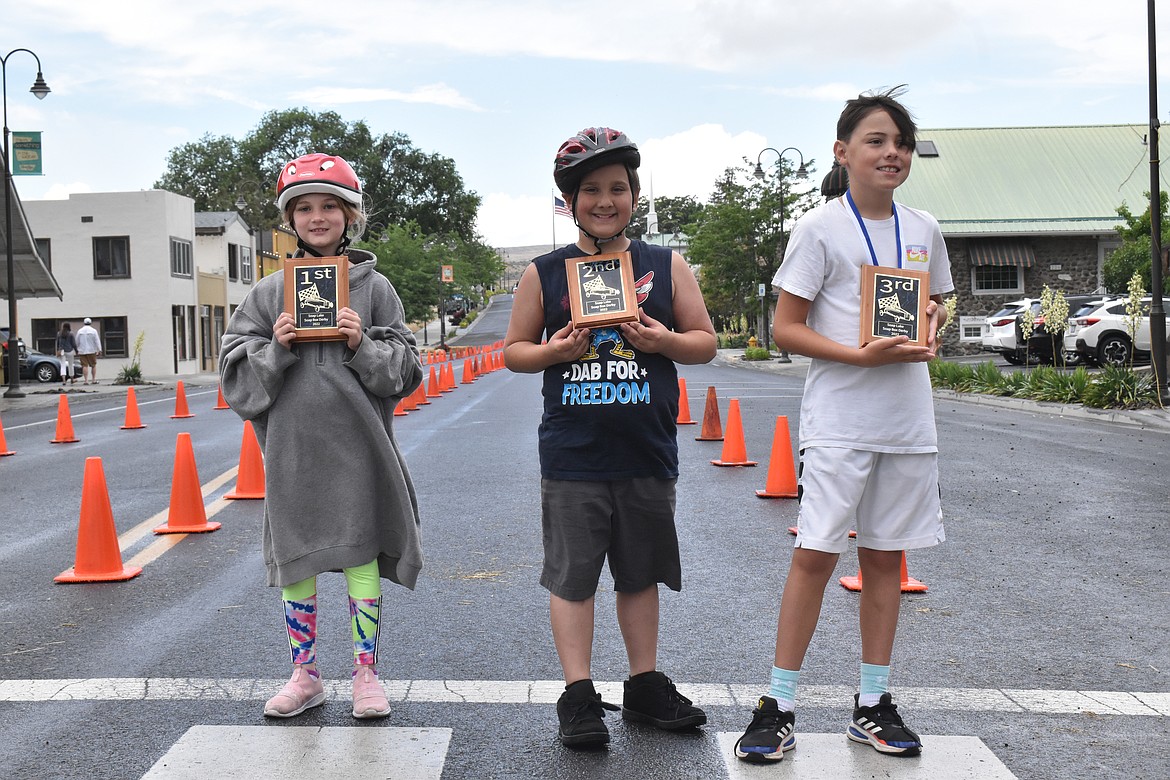 From left to right, Langstyn Rhoads, who took first, Zachary Glatmaier, who took second and Kam Schluckebier, who took third in the Soap Lake Soap Box races.