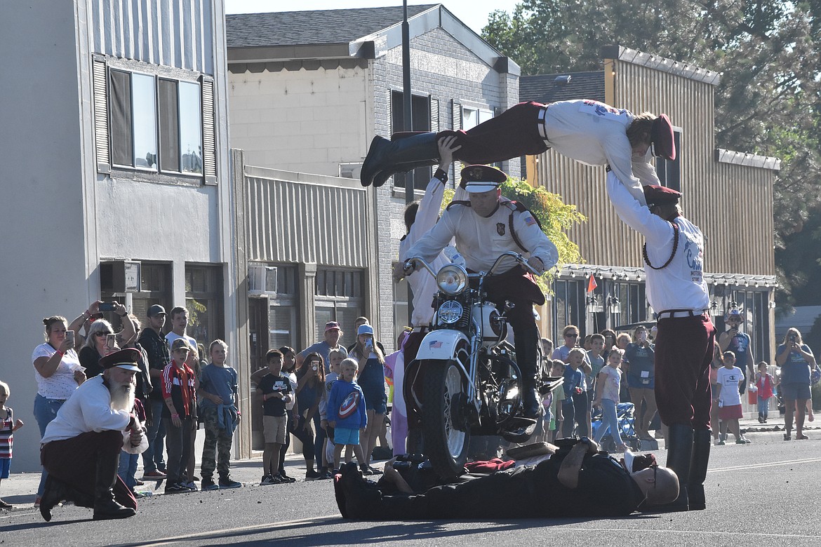 The Seattle Cossacks performed again at the end of the parade, partly due to the rain that downpoured during their initial performance. The stunt group had two SLPD officers lay on the ground with a couple of their own members as one drove their motorcycle over the top of them.