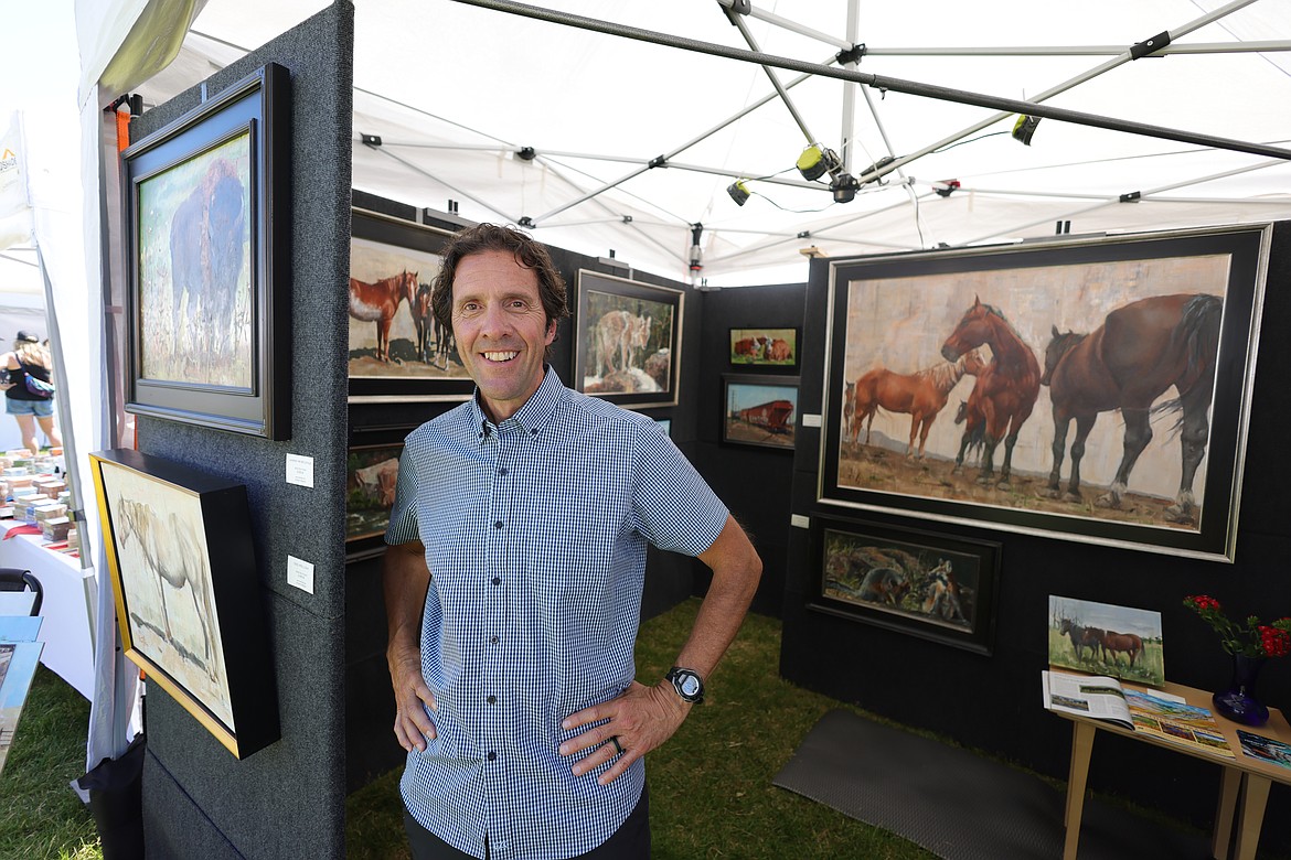 Richard Rodriguez at his art booth on display at the Whitefish Arts Festival on July 1. (JP Edge photo)