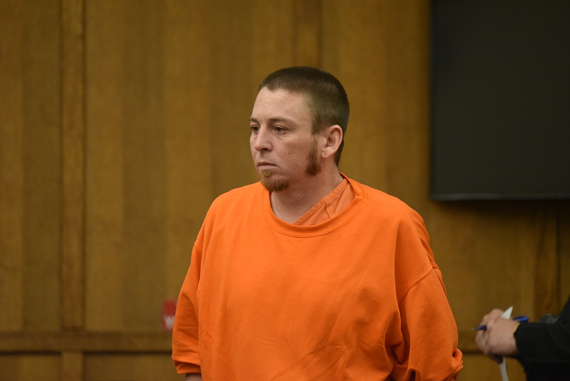 Joseph Oliver makes his way to the defendant's table inside Flathead County District Court during his June 30, 2022, arraignment before Judge Dan Wilson. (Derrick Perkins/Daily Inter Lake)