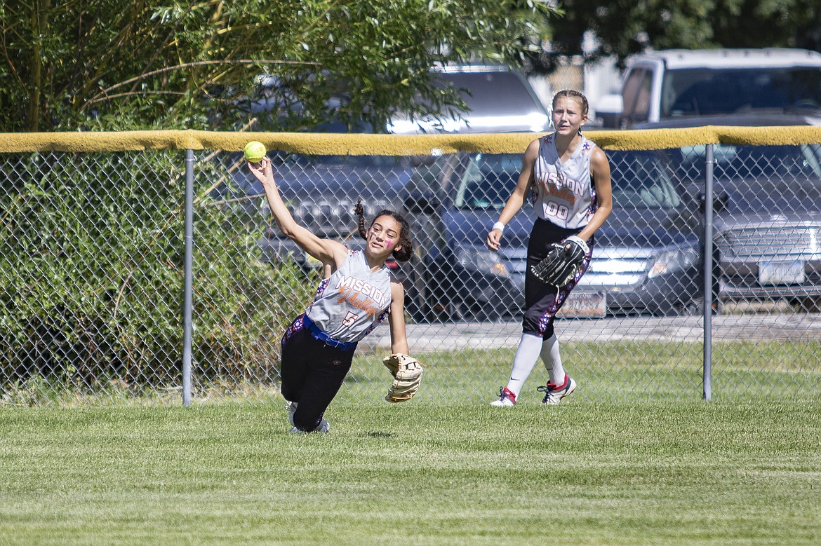 Avia Lee of the Mission Valley All Stars makes a spectacular throw from left field. (Rob Zolman/Lake County Leader)