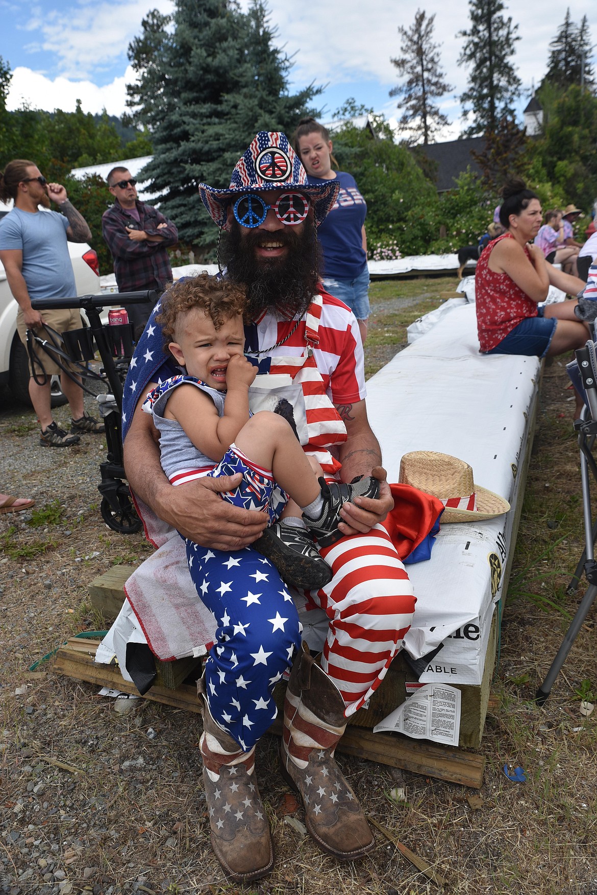 Troy resident Muley Borgmann and his son, Sawyer, "his little Captain America in training," enjoy the July 4 parade. (Scott Shindledecker/The Western News)