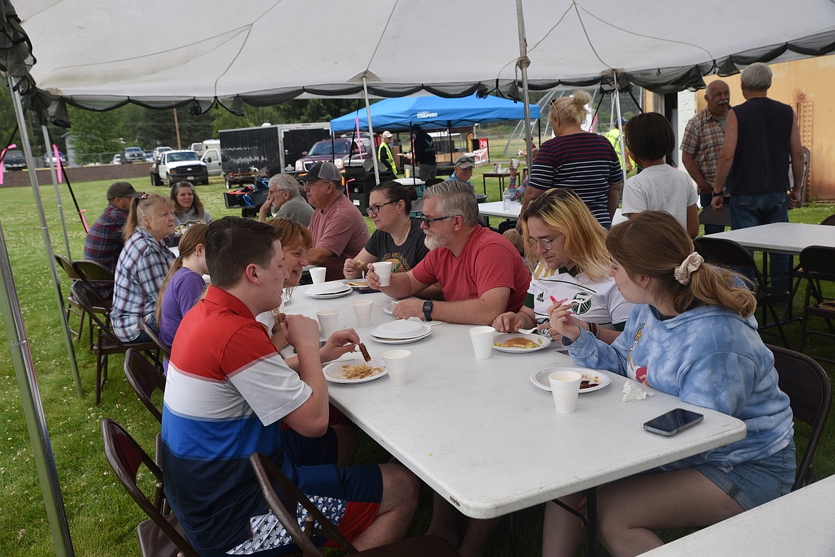 Folks enjoyed breakfast prepared by members of the Troy Chamber of Commerce on Monday at Roosevelt Park during Troy's Old Fashioned Fourth of July parade. (Scott Shindledecker/The Western News)