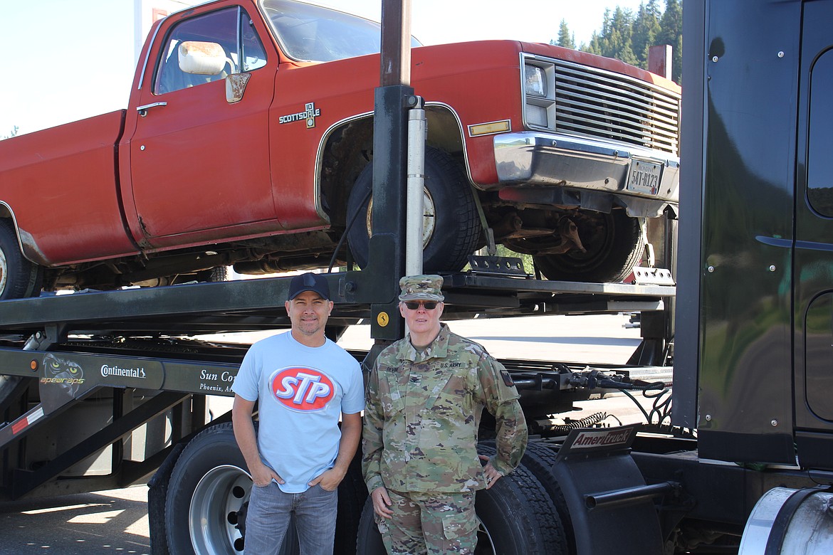 Country artist Jared Ashley and Colonel Mary Devine of the Nevada National Guard stand with "Ozzy’s truck" as it departs to Petty's Garage in North Carolina for a complete refurbishment that will tour with the Petty NASCAR Team to raise awareness of suicide in the military. (Monte Turner/Mineral Independent)