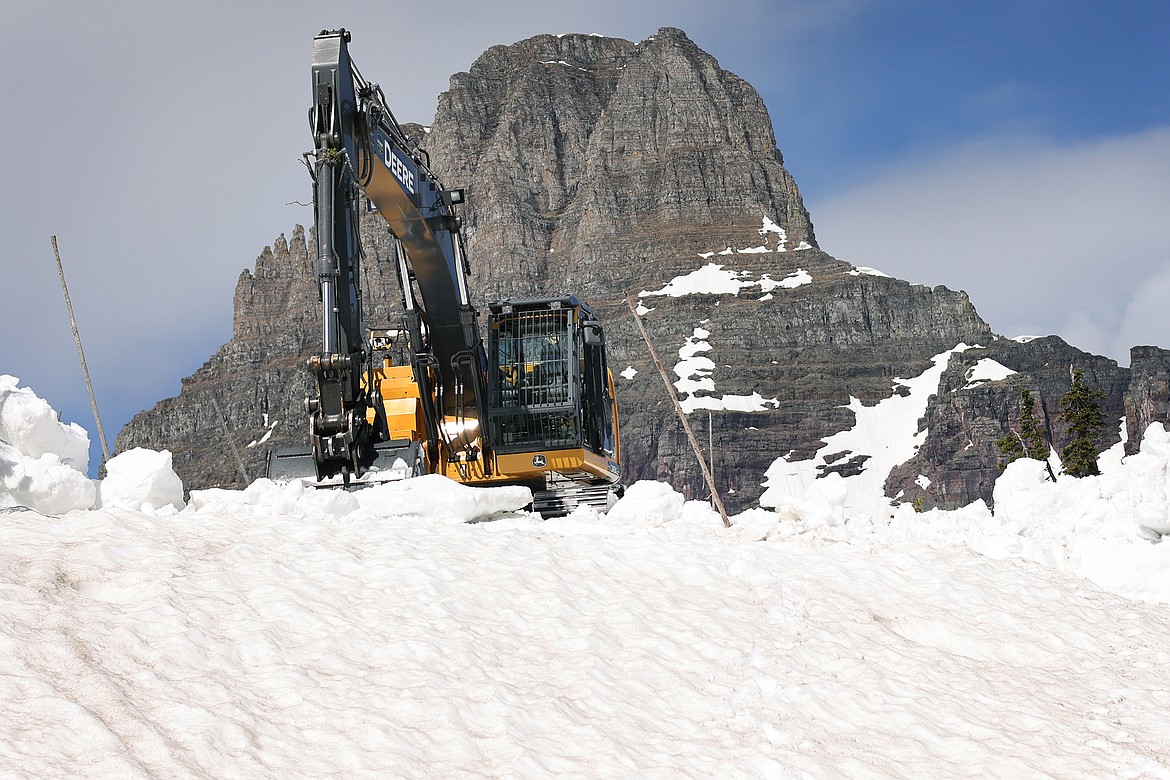 Snow removal continues around the Logan Pass Visitor Center in Glacier National Park Tuesday, July 5. (Jeremy Weber/Daily Inter Lake)