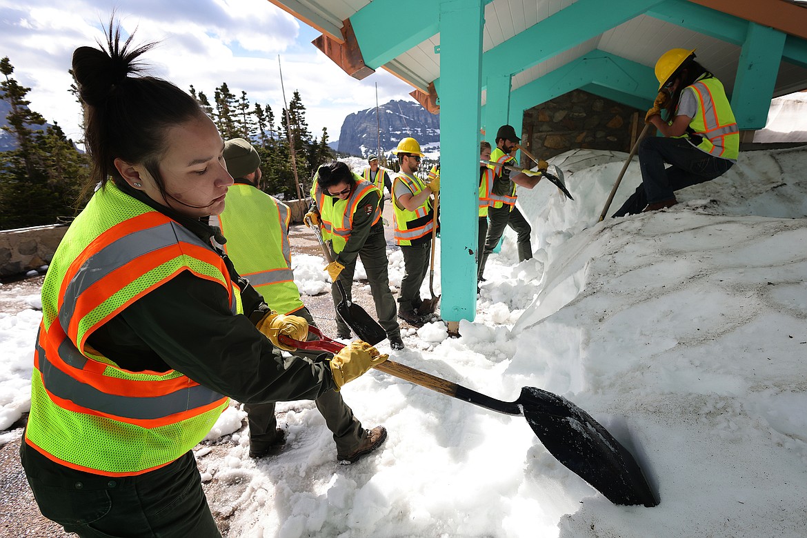 Crews clear the snow from the Logan Pass Visitor Center at the top of Going to the Sun Road Tuesday, July 5. Park officials say the road will not be open until July 13 at the earliest. (Jeremy Weber/Daily Inter Lake)