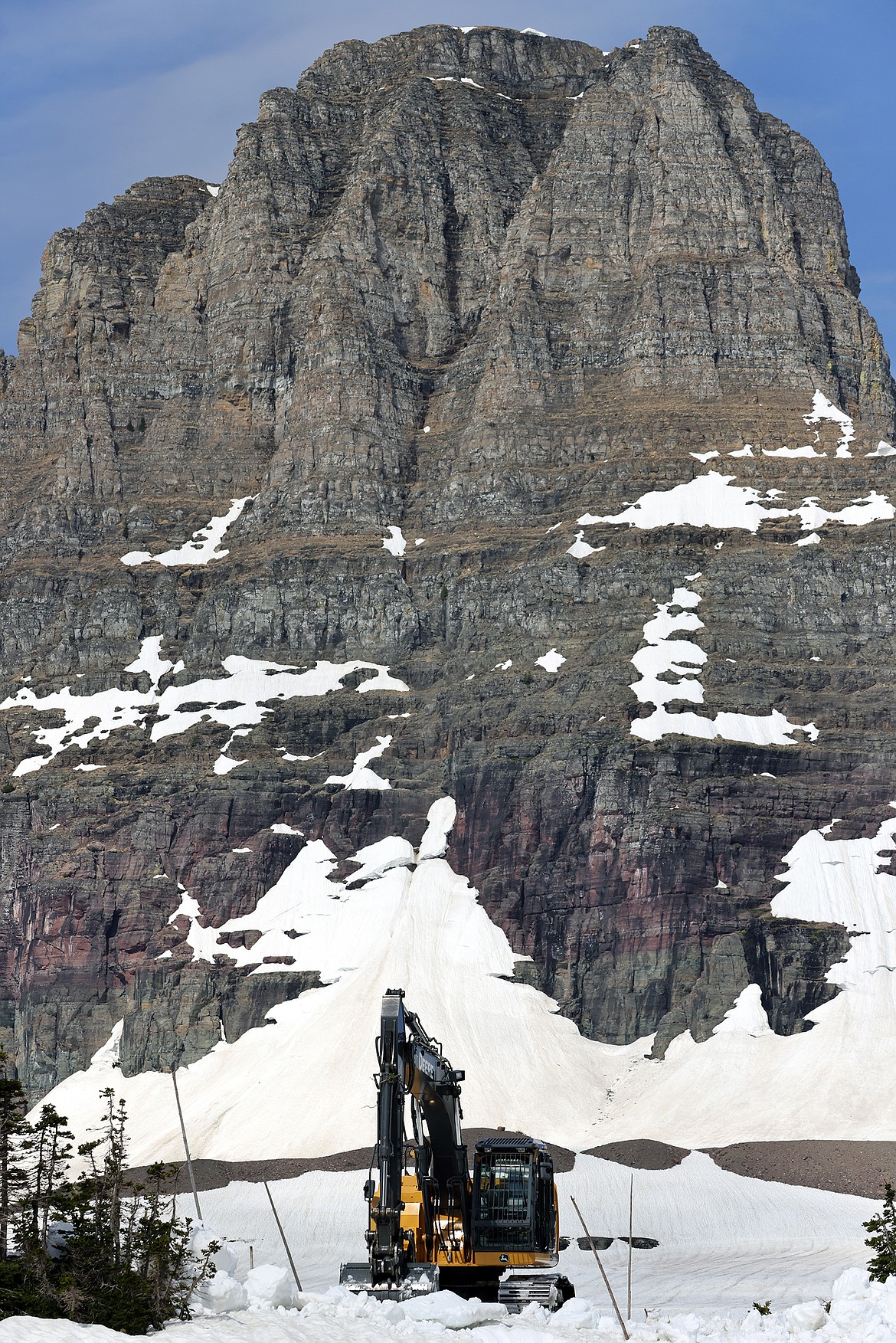 Snow removal continues around the Logan Pass Visitor Center in Glacier National Park Tuesday, July 5. (Jeremy Weber/Daily Inter Lake)