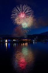 Colors explode across the sky over Lake Coeur d'Alene during the 2022 annual Fourth of July fireworks show.