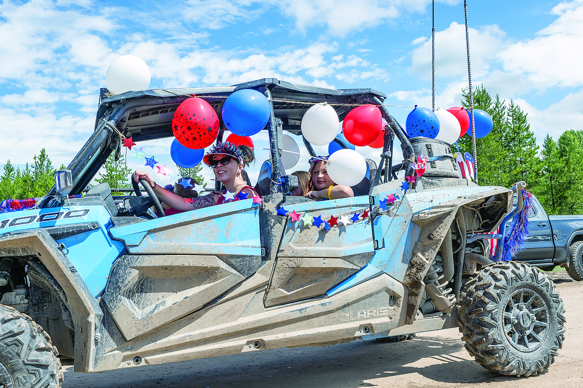 Revelers decked out this side-by-side.