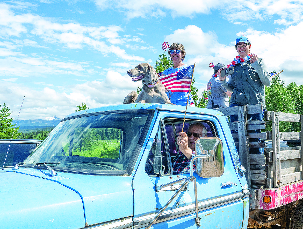 An old truck, a dog and some flags make for a pretty good float. The July 4 parade takes about 10 minutes.