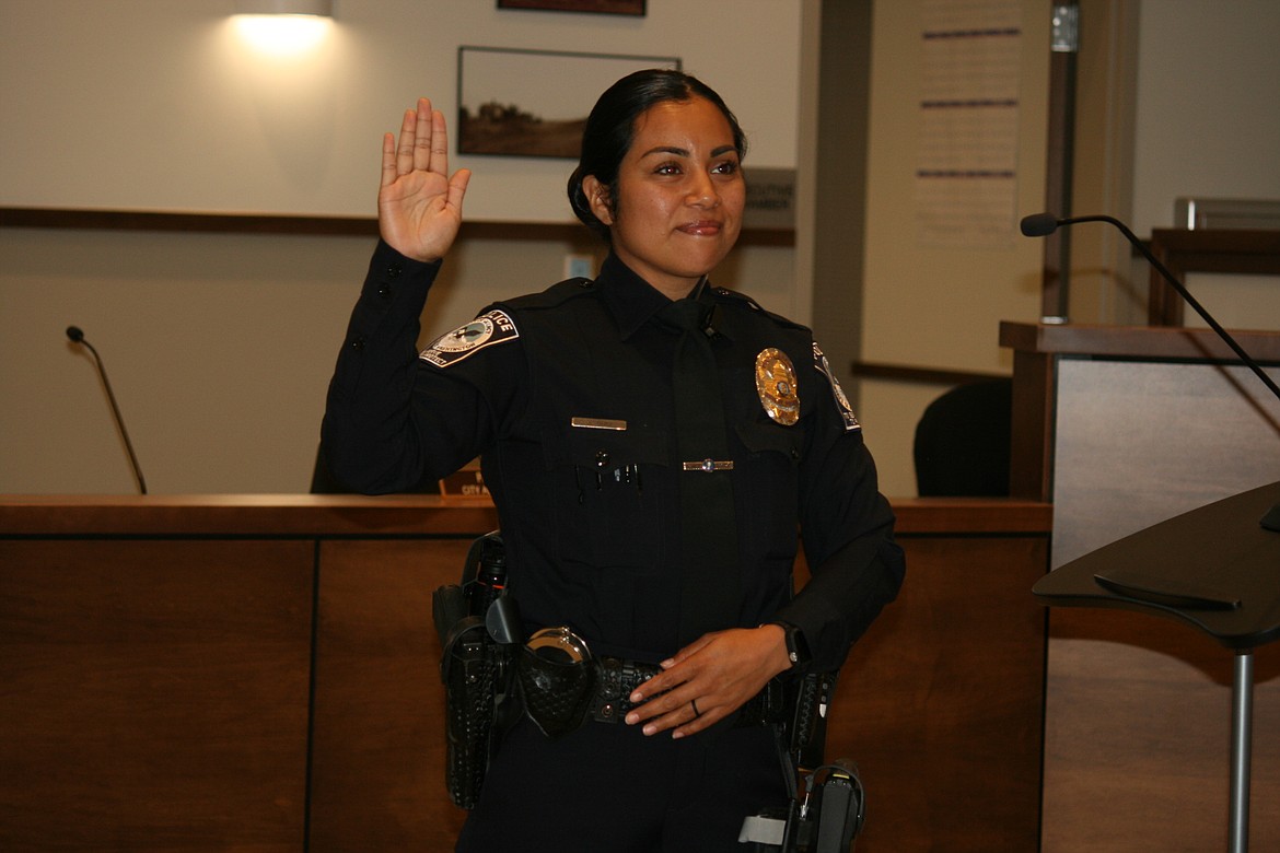 New Quincy Police Department officer Jessica Diaz takes the oath during the Quincy City Council meeting Tuesday.