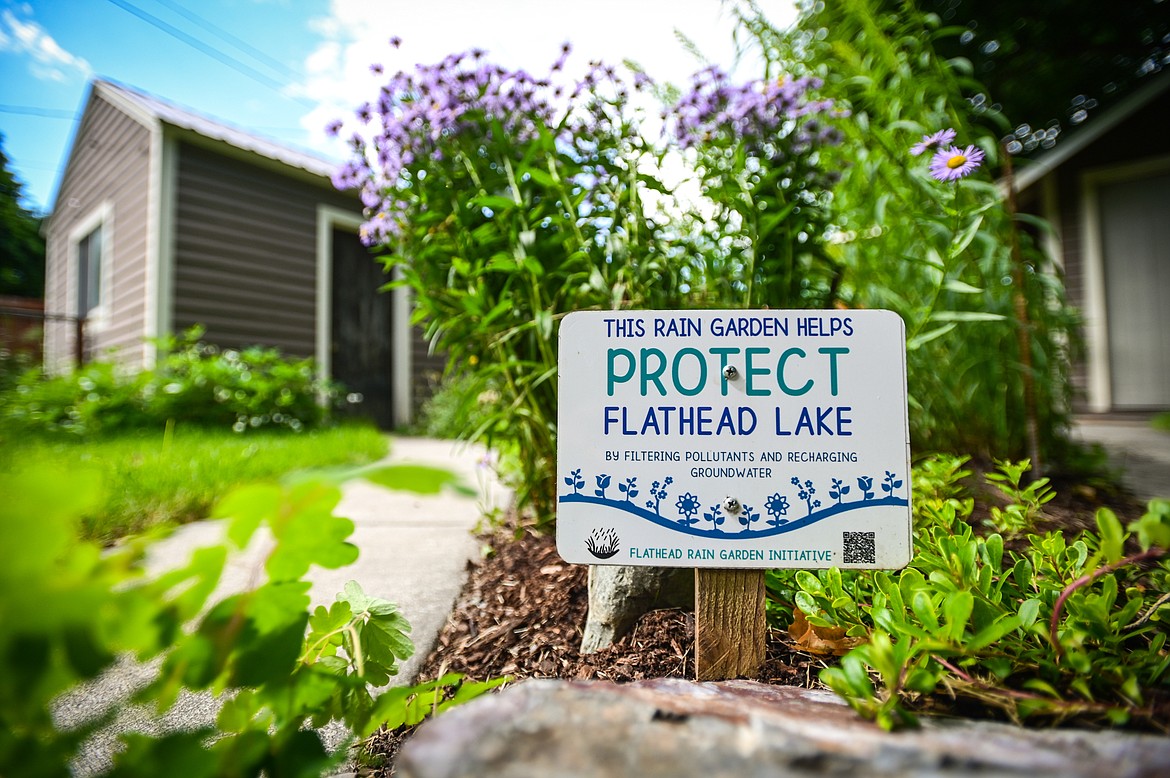 A sign at the corner of Shannon Freix's backyard rain garden for the Flathead Rain Garden Initiative, a collaborative program  between the City of Kalispell and Flathead Conservation District on Wednesday, July 6. (Casey Kreider/Daily Inter Lake)