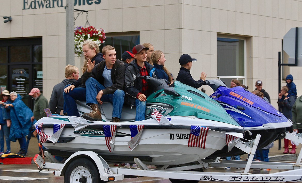 Search and Rescue showing off their equipment and kids at the 4ht of July Parade.