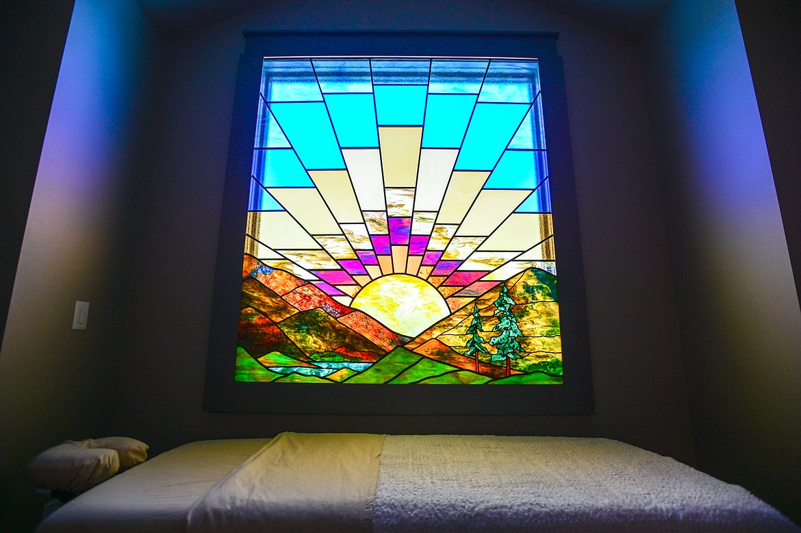 A stained-glass window in the spa area that was commissioned by an artist in Missoula at the Sunshine Factory on Thursday, July 7. (Casey Kreider/Daily Inter Lake)