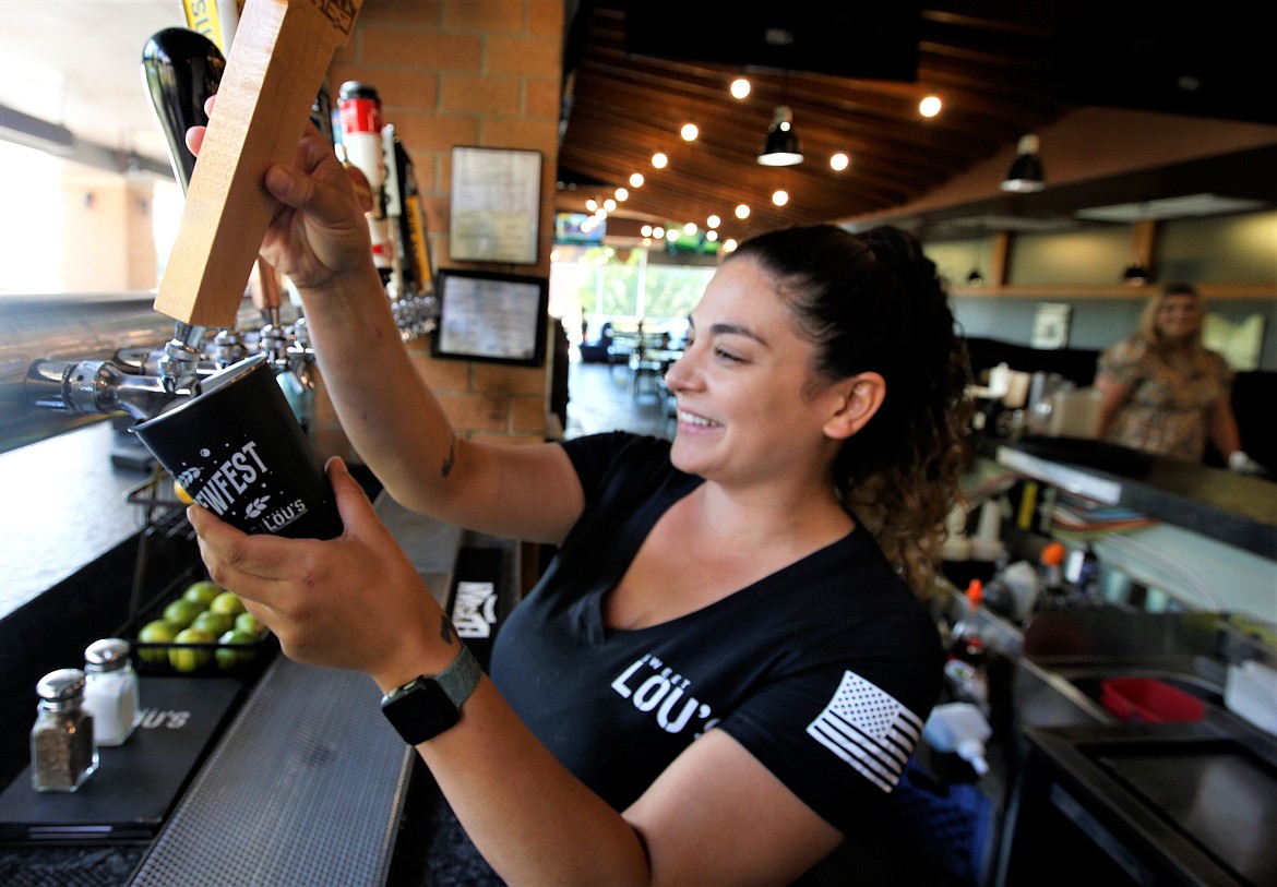 Katlyn Nava pours a beer at Sweet Lou's on Thursday. Sweet Lou's is the sponsor of Brewfest at McEuen Park on Saturday.