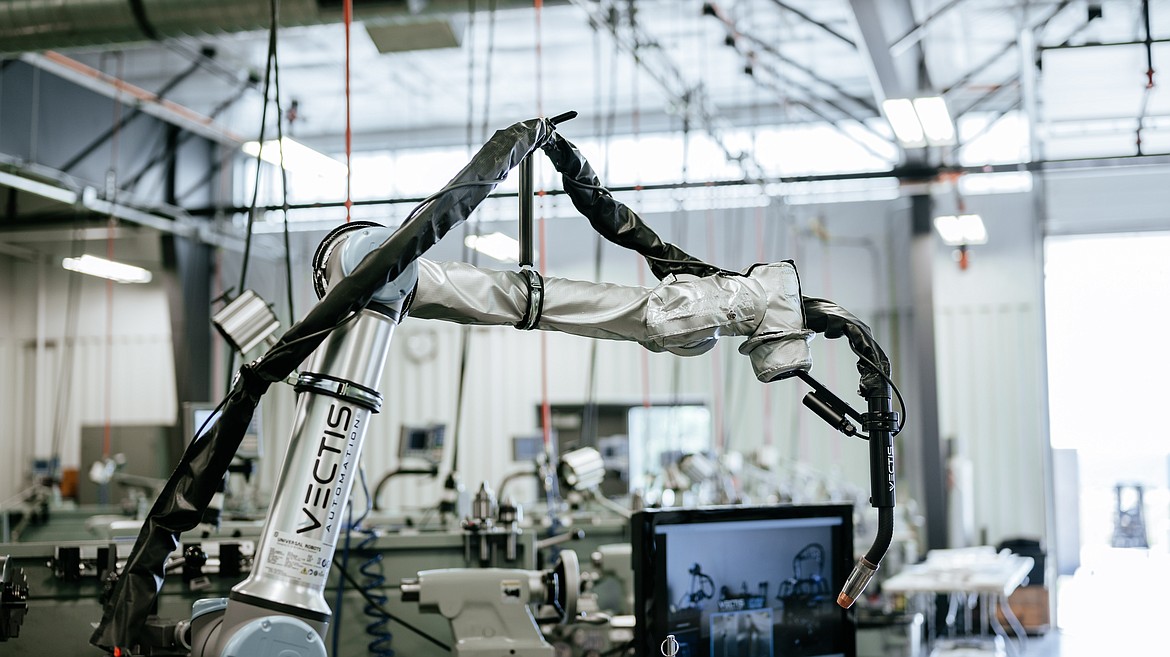 An automated welding system from Vectis Automation was one of several robot systems on display during a robot demonstration event for regional companies Thursday at NIC’s Parker Technical Education Center in Rathdrum.