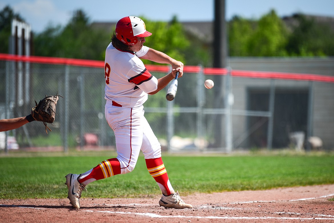 Kalispell Lakers A's Michael Owens (8) connects at the plate against the Bozeman Bucks in the John R. Harp Memorial Baseball Tournament at Griffin Field on Friday, July 8. (Casey Kreider/Daily Inter Lake)