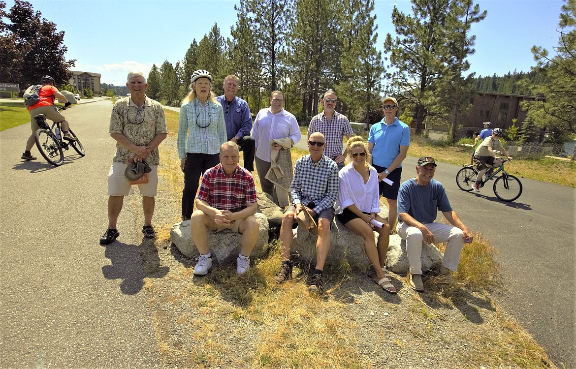 North Idaho Centennial Trail users, supporters and board members gather Friday where a greenbelt will be developed next to the trail. Front row from left, Chris Guggemos, Kurt Katzer, Tabitha Kraack-Bonner and Doug Eastwood. Back row from left, Sandy Emerson, Sherry Robinson, Bill Greenwood, Peter Faucher,Kevan McCrummen and Mike Gridley.