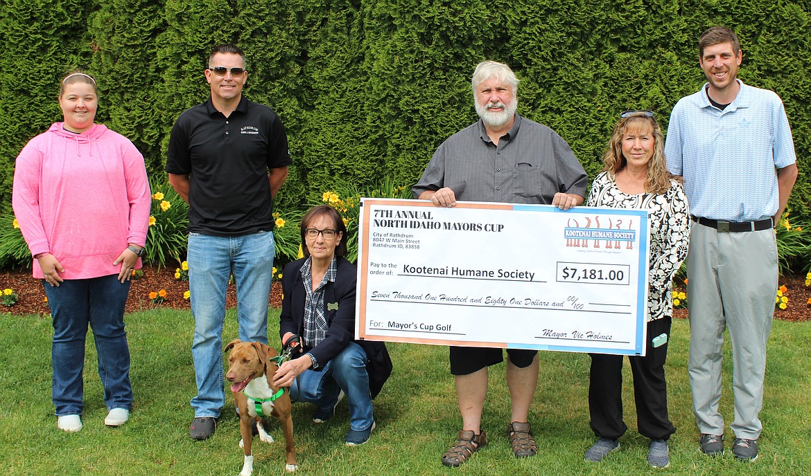 The 7th annual Mayors' Cup Charity Golf Tournament raised more than $7,100 on June 18 for the Companions Animal Center, formerly Kootenai Humane Society. Raffle prizes and lunch was provided by Twin Lakes Village Golf Club. From left: Cora Wilt, Rathdrum Parks and Recreation assistant; Eric Singer, Rathdrum Parks and Recreation director; Vicky Nelson, Companions Animal Center development director, and Bronson; Rathdrum Mayor Vic Holmes; Sheri Holmes, Rathdrum Parks & Recreation Commission; and CJ Nagel, Head Golf Pro Twin Lakes Village Golf Course.