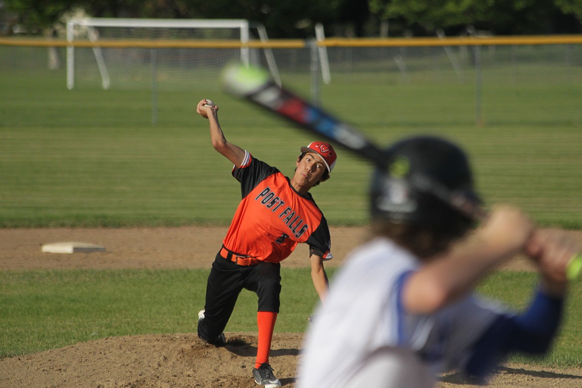 MARK NELKE/Press
Tim Howard of Post Falls pitches to Finley Moore of Coeur d'Alene on Friday night at Canfield Sports Complex in Game 1 of a best-of-3 series for the Idaho Little League District 1 Juniors championship. Post Falls went on to win.
In the other best-of-3 series for the District 1 title, Lewiston beat Coeur d’Alene in Little League Majors (12U), Coeur d’Alene beat Lewiston in 11U, and Lewiston beat Coeur d’Alene in 10U.
Game 2 in all four divisions is today at 10 a.m. at Canfield; Game 3, if necessary, is Sunday at 10 a.m.