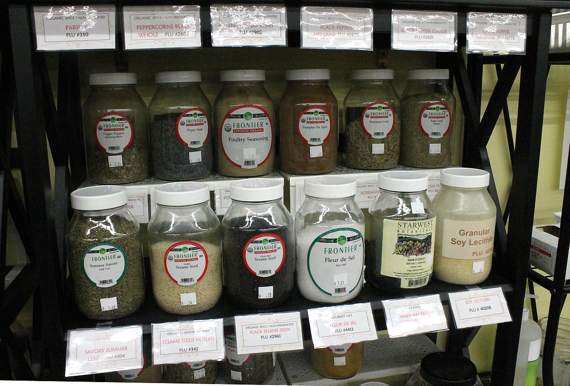 Rows of jars hold Settler’s Natural Market’s offerings of grains, flours and other bulk products.