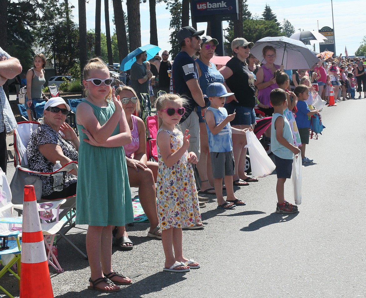 Post Falls sisters Cadence Shipp, 8, left, and Tinsley Shipp, 6, sport super cool shades on a sunny Saturday morning during the Post Falls Festival Parade.