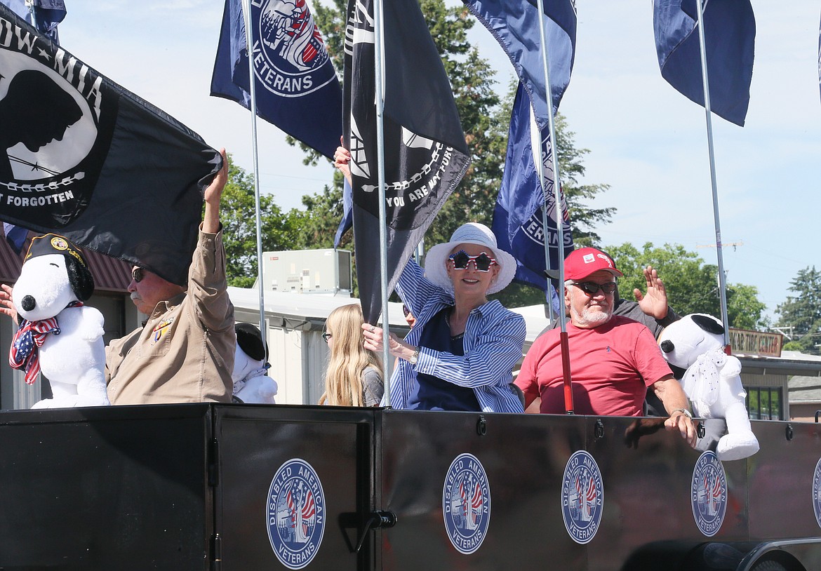 Barb Nelson wears star-spangled sunglasses as she rides with the Disabled American Veterans in the Post Falls Festival Parade.